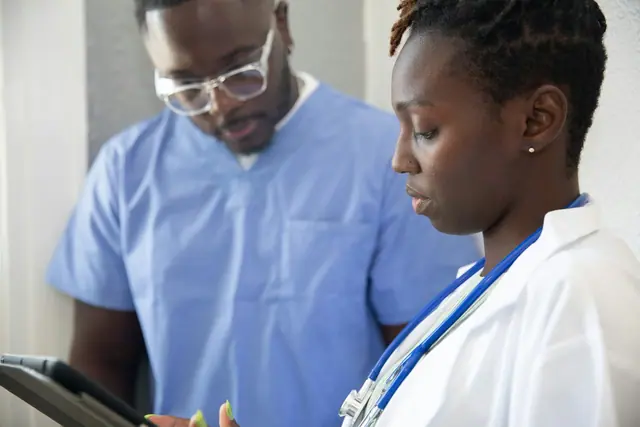 Healthcare professionals review information together